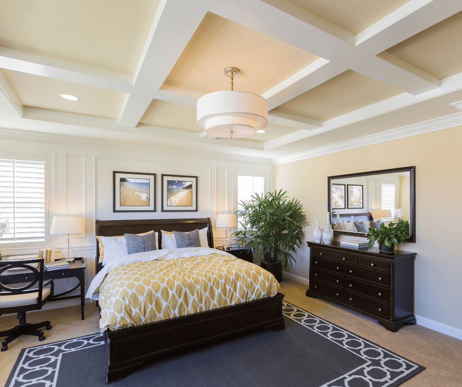 master bedroom, yellow comforter, blue rug